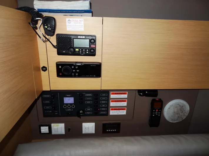 America Yacht Photos Pics Control panel of a 2018 Beneteau Oceanis 38 sailboat with communication and navigation equipment.