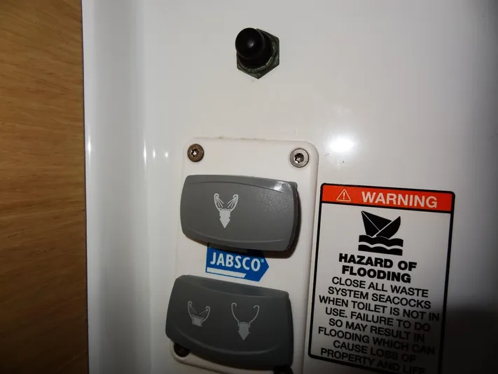 America Yacht Photos Pics Jabsco control panel with warning label on a 2018 Beneteau Oceanis 38 sailboat.