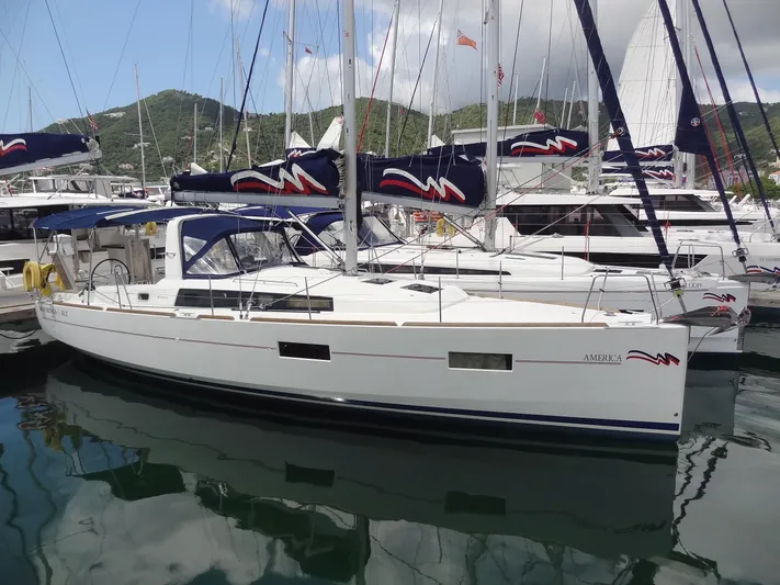 America Yacht Photos Pics 2018 Beneteau Oceanis 38 sailboat docked in a marina.