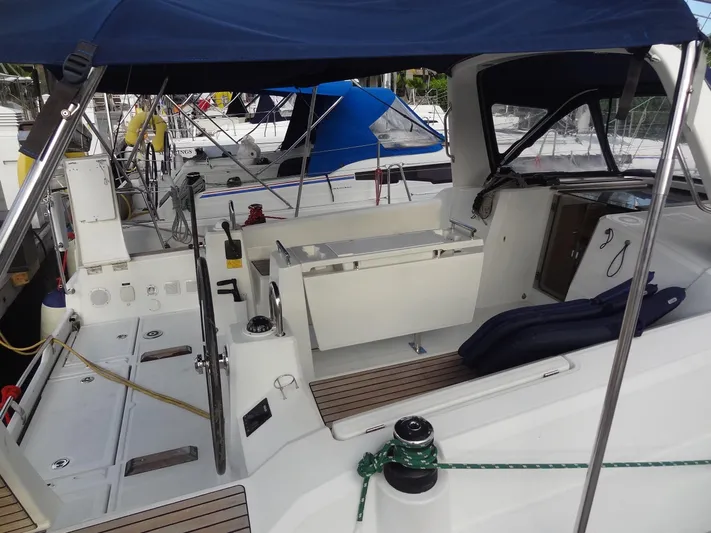 America Yacht Photos Pics 2018 Beneteau Oceanis 38 sailboat cockpit with blue canopy and modern amenities.