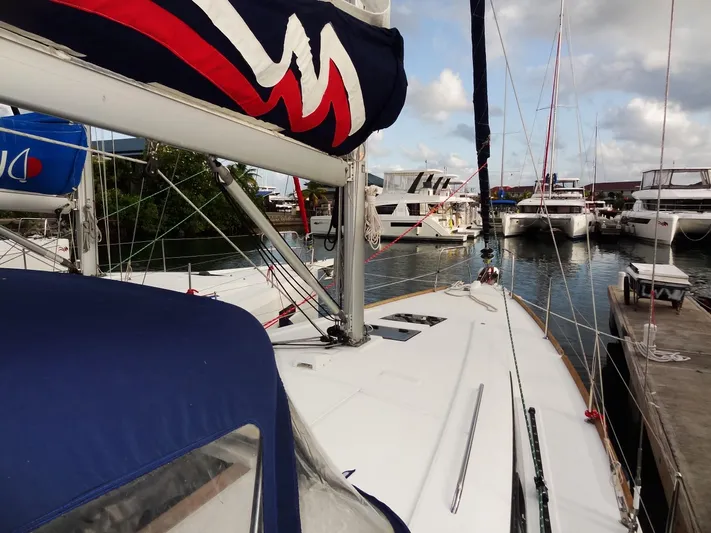 America Yacht Photos Pics 2018 Beneteau Oceanis 38 sailboat docked in a marina.
