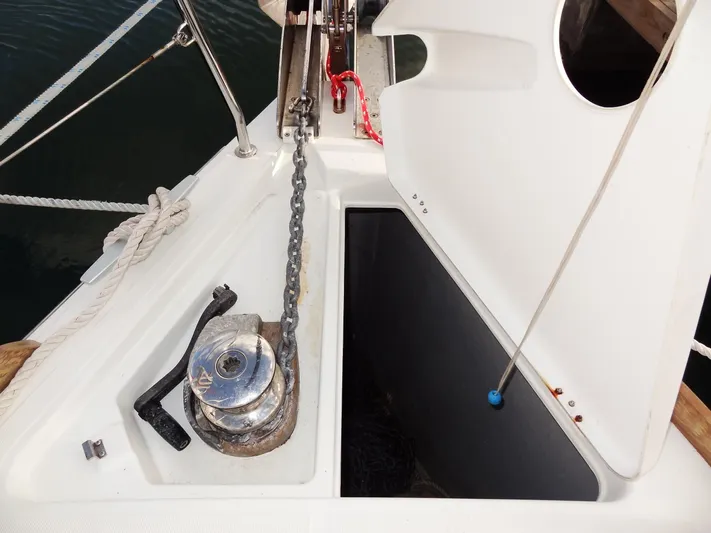 America Yacht Photos Pics Anchor locker of 2018 Beneteau Oceanis 38 sailboat with windlass and chain.