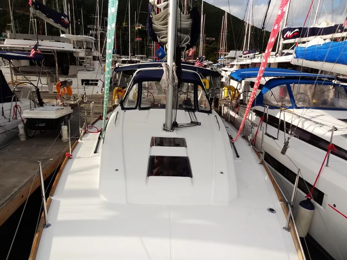 America Yacht Photos Pics 2018 Beneteau Oceanis 38 sailboat docked in a marina.