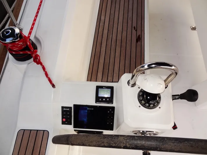 America Yacht Photos Pics Cockpit of 2018 Beneteau Oceanis 38 sailboat with navigation instruments and steering wheel.