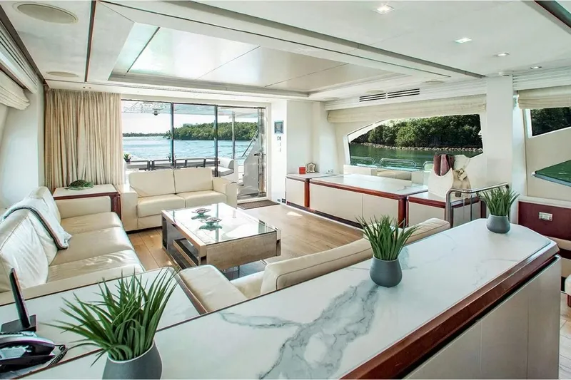 Bt2 Yacht Photos Pics Luxurious interior of 2010 Azimut 95 yacht with elegant seating and scenic water views.