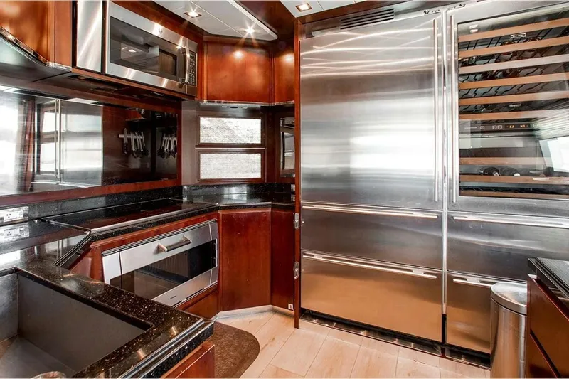 Bt2 Yacht Photos Pics Luxurious kitchen interior of 2010 Azimut 95 yacht with stainless steel appliances.