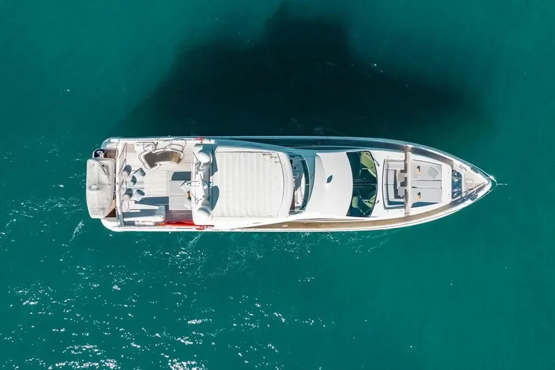 Bt2 Yacht Photos Pics Aerial view of 2010 Azimut 95 yacht on turquoise water.