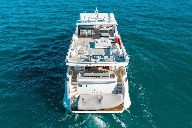 Bt2 Yacht Photos Pics Luxurious 2010 Azimut 95 yacht cruising on open blue sea.