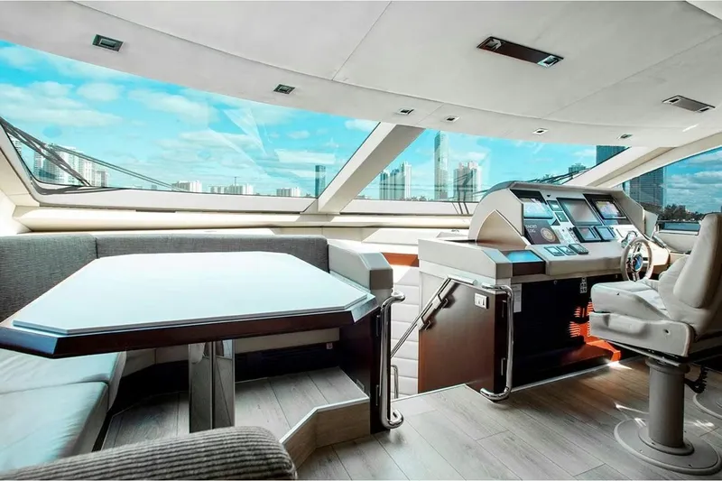 Bt2 Yacht Photos Pics Luxurious interior of 2010 Azimut 95 yacht with modern helm and seating area.