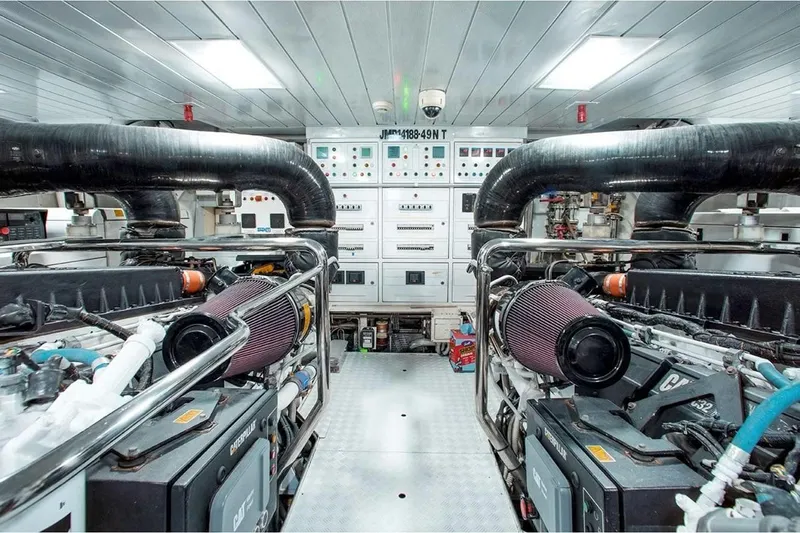 Bt2 Yacht Photos Pics Engine room of 2010 Azimut 95 yacht, featuring dual Caterpillar engines and control panels.