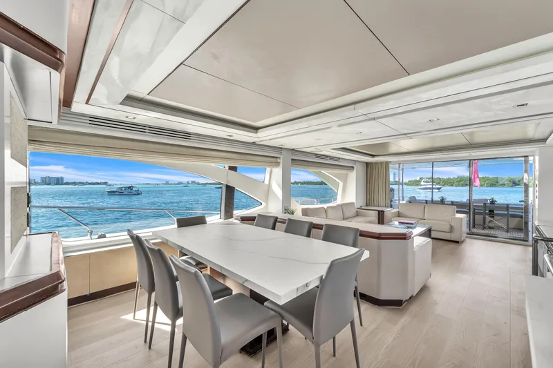 Bt2 Yacht Photos Pics Luxurious interior of 2010 Azimut 95 yacht with elegant dining area and scenic ocean views.