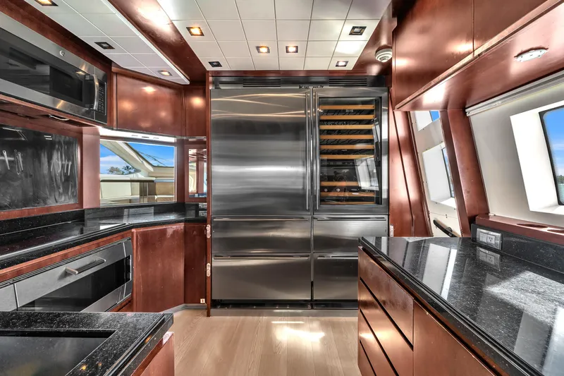 Bt2 Yacht Photos Pics Luxurious kitchen interior on 2010 Azimut 95 yacht with modern appliances and sleek design.