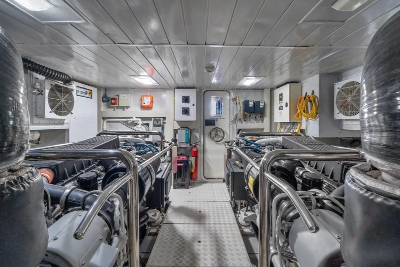 Bt2 Yacht Photos Pics Engine room of a 2010 Azimut 95 yacht, featuring dual engines and control systems.