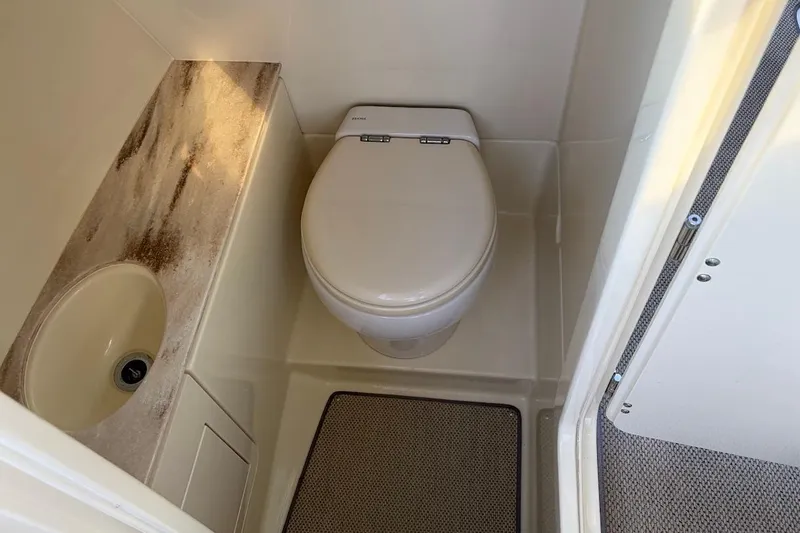  Yacht Photos Pics 2020 Chris-Craft Launch 28 boat bathroom with toilet and sink.