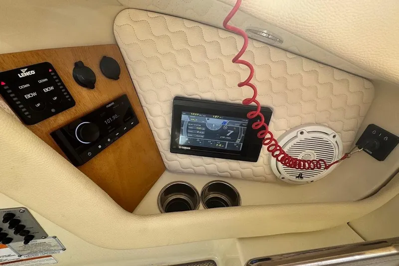  Yacht Photos Pics 2020 Chris-Craft Launch 28 dashboard with controls, display, and speaker system.