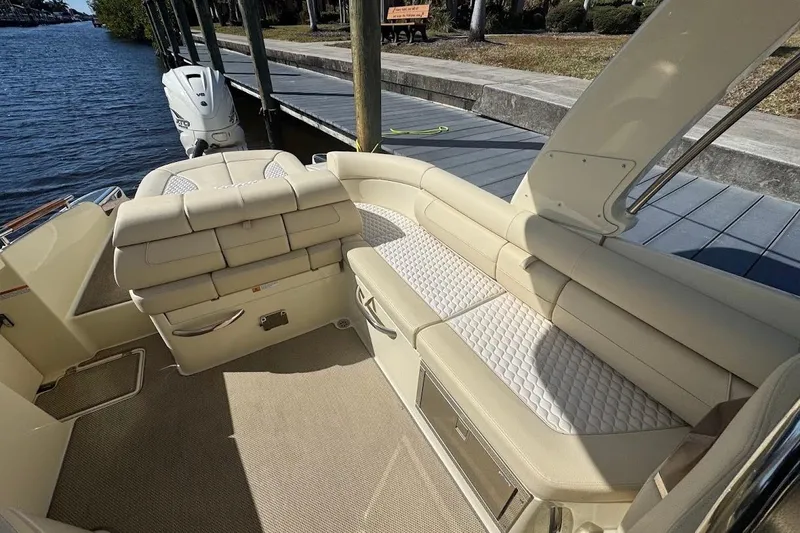  Yacht Photos Pics 2020 Chris-Craft Launch 28 boat interior with beige seating and waterfront view.
