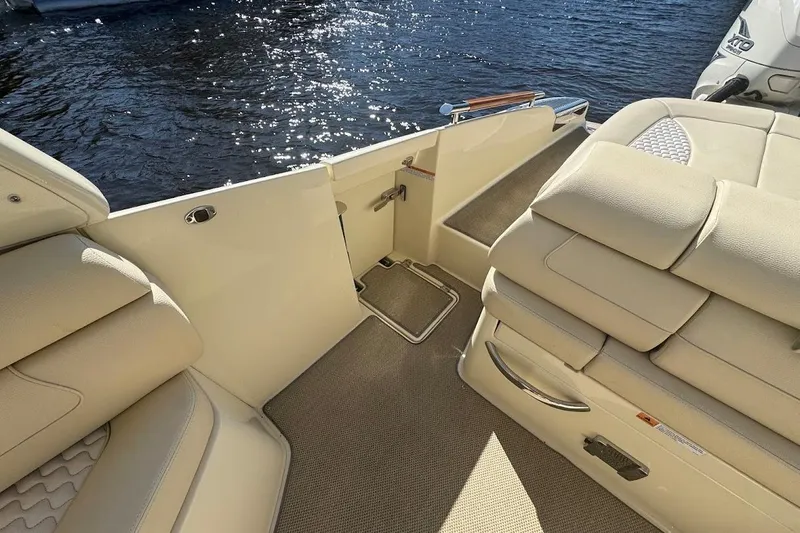  Yacht Photos Pics 2020 Chris-Craft Launch 28 interior with beige seating and water view.