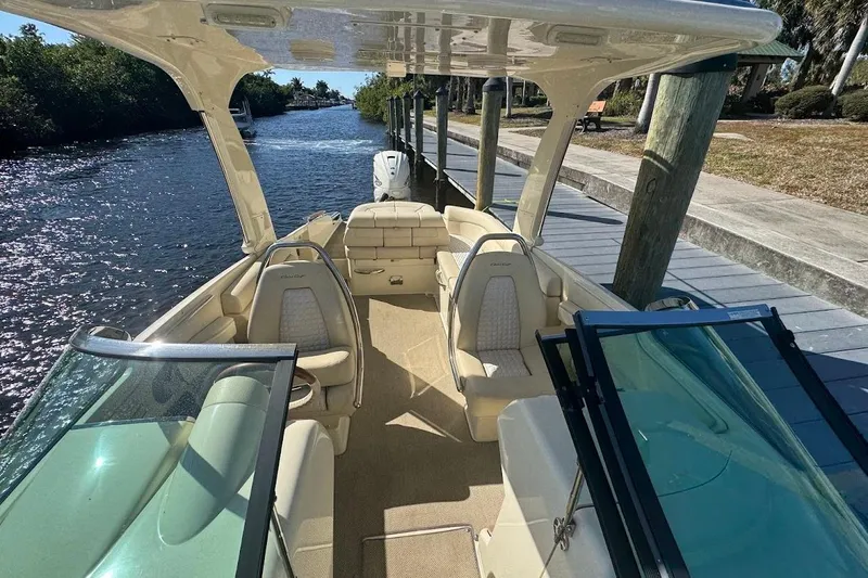  Yacht Photos Pics 2020 Chris-Craft Launch 28 boat docked by a scenic waterway.