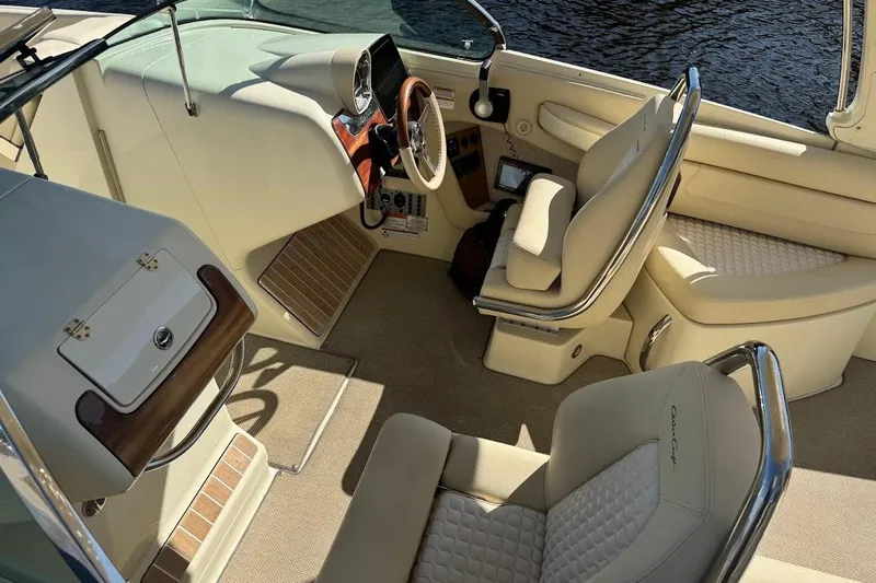  Yacht Photos Pics 2020 Chris-Craft Launch 28 boat interior with luxurious seating and steering console.