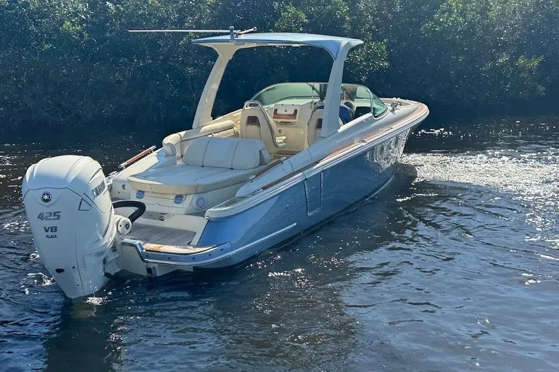  Yacht Photos Pics 2020 Chris-Craft Launch 28 boat cruising on water, featuring sleek design and powerful engine.