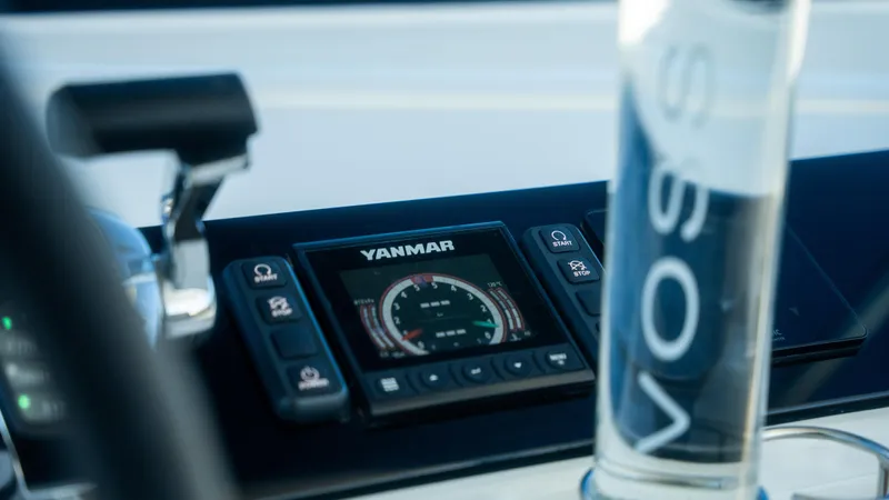 Infinity Yacht Photos Pics Control panel of 2023 Lagoon 46 yacht with Yanmar display and Voss water bottle.