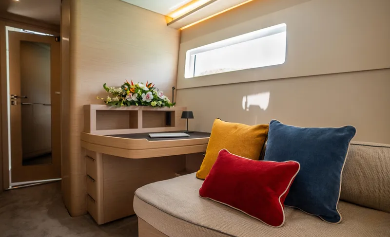 Infinity Yacht Photos Pics Interior of 2023 Lagoon 46 yacht with colorful cushions and elegant decor.
