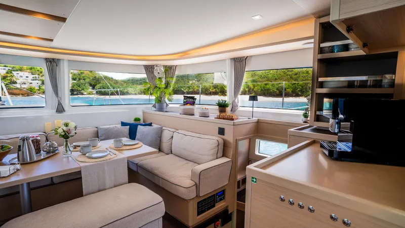 Infinity Yacht Photos Pics Luxurious interior of 2023 Lagoon 46 yacht with elegant seating and scenic views.