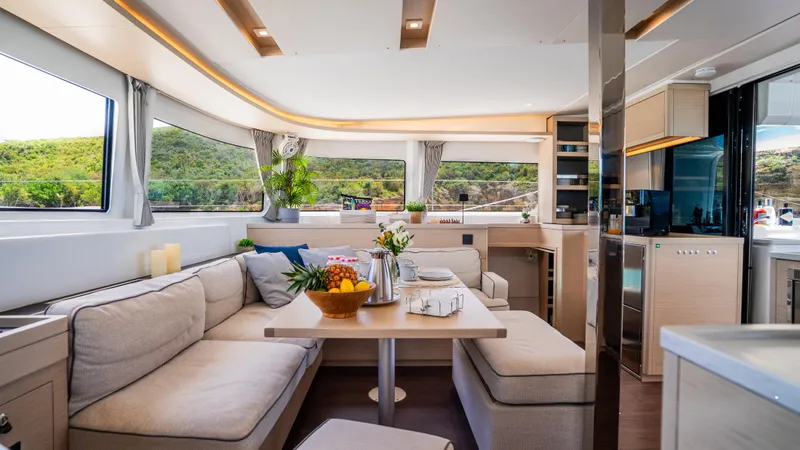 Infinity Yacht Photos Pics Luxurious interior of 2023 Lagoon 46 yacht with elegant seating and modern amenities.