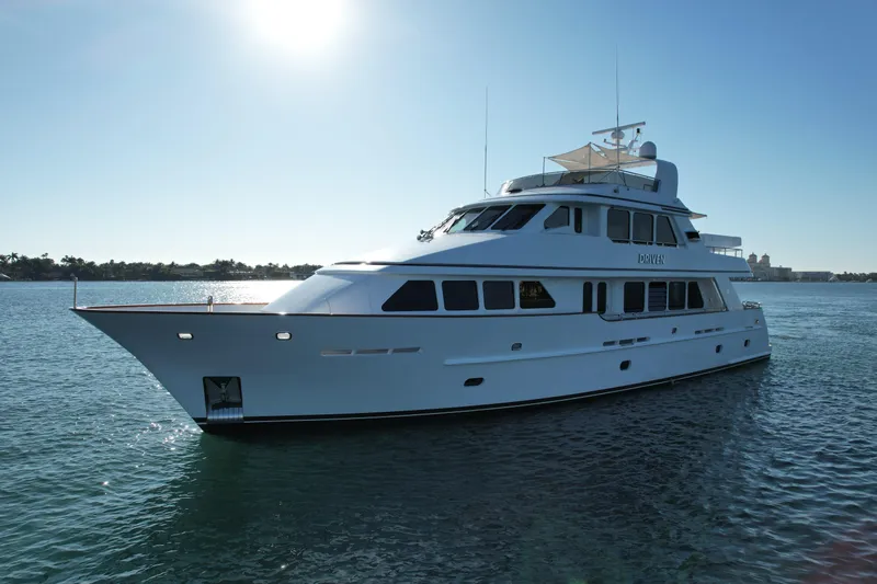 Driven Yacht Photos Pics Luxury Conrad 88 yacht from 2005 cruising on calm waters under clear sky.