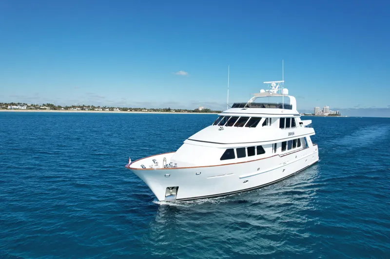 Driven Yacht Photos Pics Luxury Conrad 88 yacht cruising on blue ocean, 2005 model.