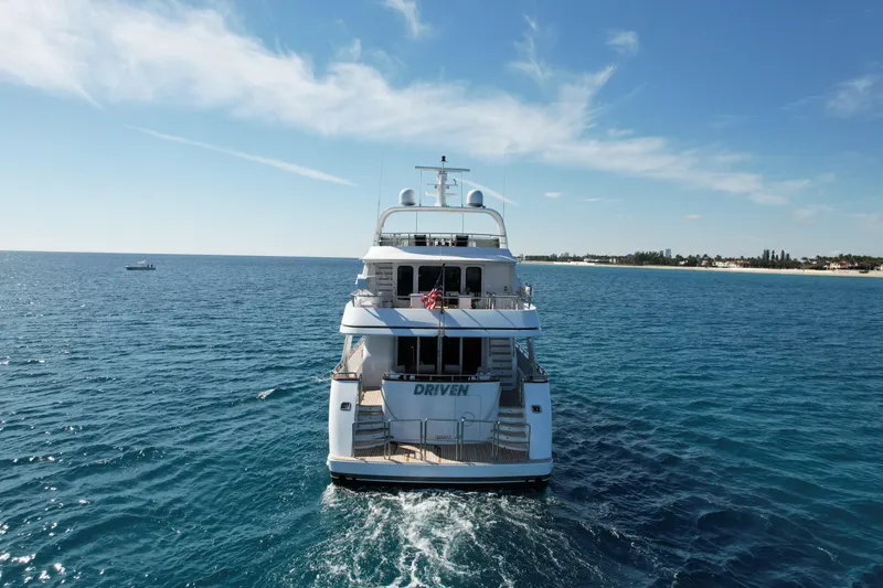 Driven Yacht Photos Pics Luxury yacht Conrad 88 (2005) cruising on open sea under clear blue sky.