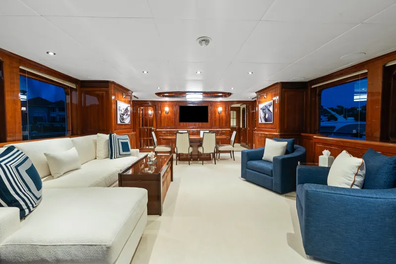 Driven Yacht Photos Pics Luxurious interior of a 2005 Conrad 88 yacht with elegant seating and wooden paneling.