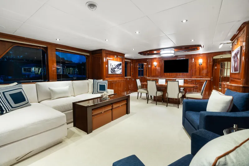 Driven Yacht Photos Pics Luxurious interior of a 2005 Conrad 88 yacht with elegant wood paneling and plush seating.