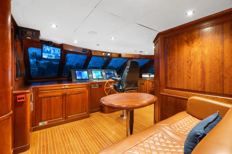 Driven Yacht Photos Pics Luxurious Conrad 88 yacht interior with wood paneling and advanced navigation equipment, 2005 model.