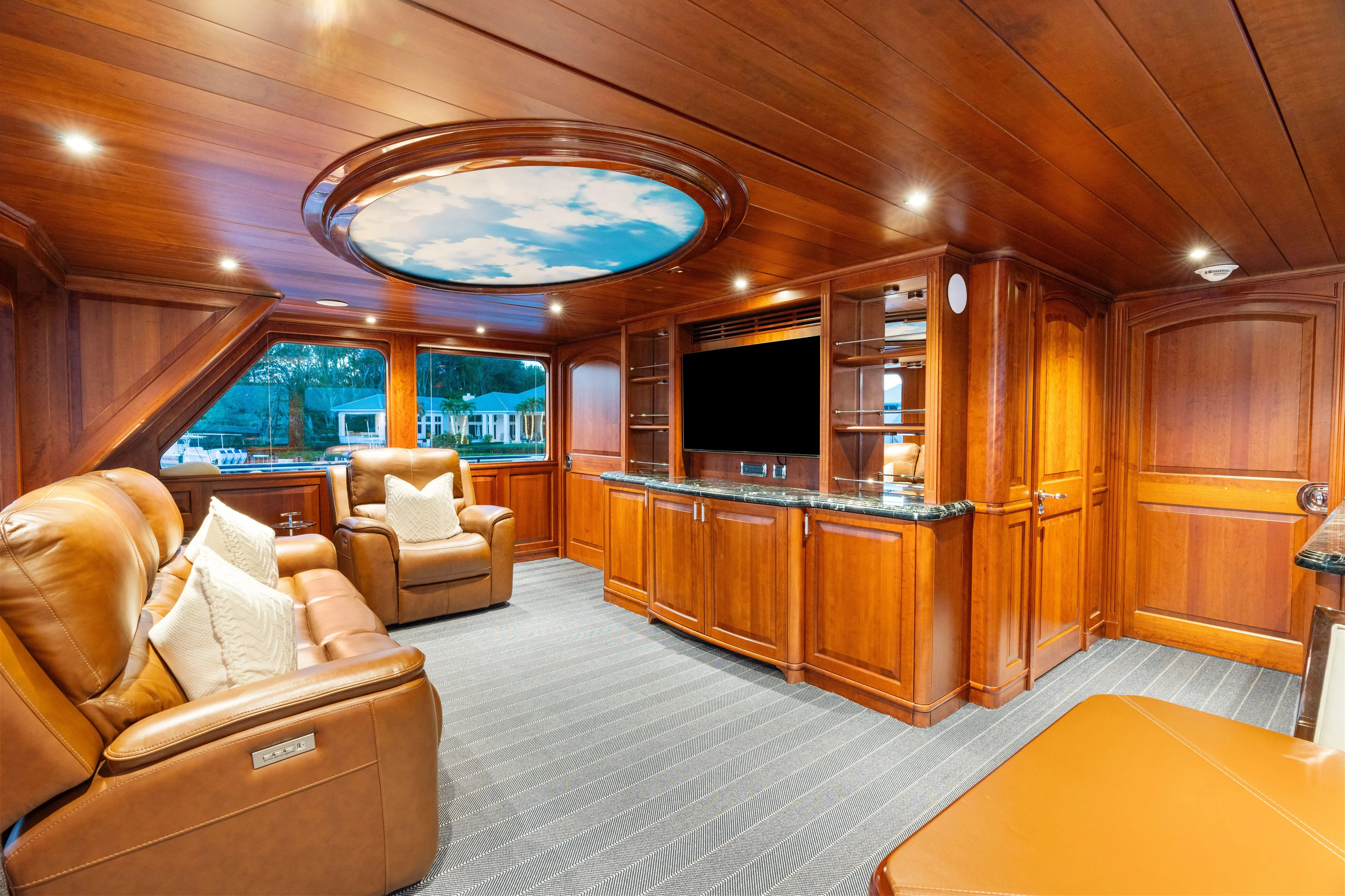 Driven Yacht Photos Pics Luxurious yacht interior with leather seating, wood paneling, and a ceiling mural, Conrad 88, 2005.