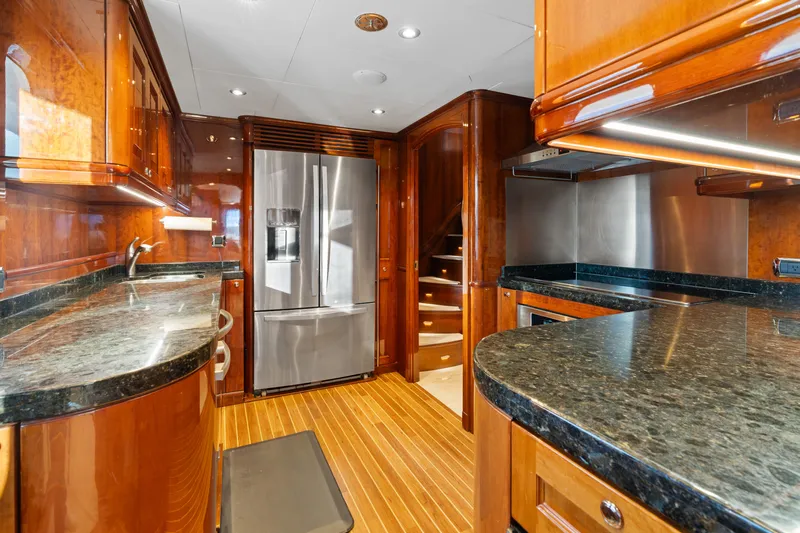 Driven Yacht Photos Pics Luxurious Conrad 88 yacht kitchen with wood cabinetry and stainless steel appliances, 2005 model.