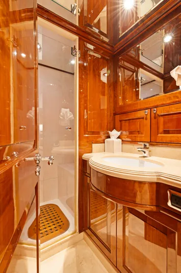 Driven Yacht Photos Pics Luxurious wooden bathroom interior on Conrad 88 yacht, 2005 model, featuring elegant fixtures and shower.