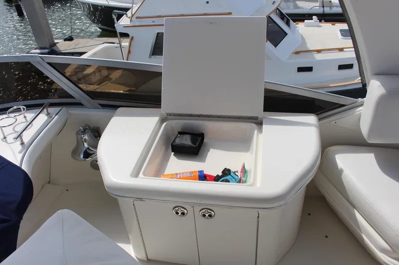 Passst Times Yacht Photos Pics 2005 Sea Ray 420 Sedan Bridge yacht interior with open storage compartment.