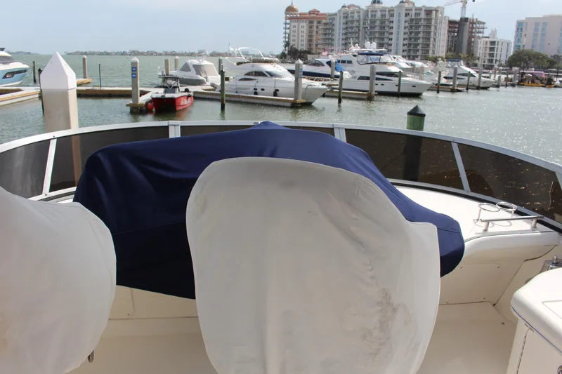 Passst Times Yacht Photos Pics 2005 Sea Ray 420 Sedan Bridge at marina with covered seating and waterfront view.