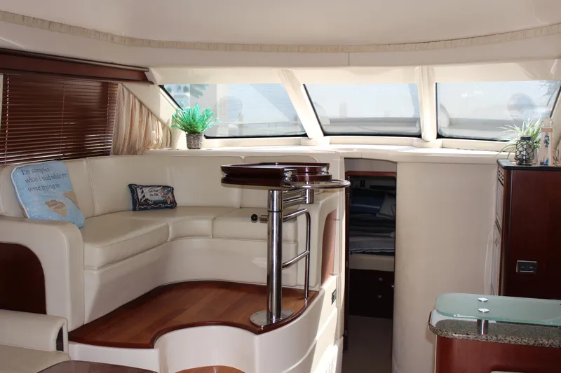 Passst Times Yacht Photos Pics Luxurious interior of 2005 Sea Ray 420 Sedan Bridge yacht with elegant seating and decor.