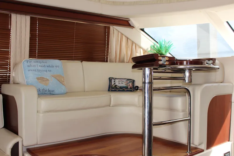 Passst Times Yacht Photos Pics Luxurious interior of 2005 Sea Ray 420 Sedan Bridge with elegant seating and decor.