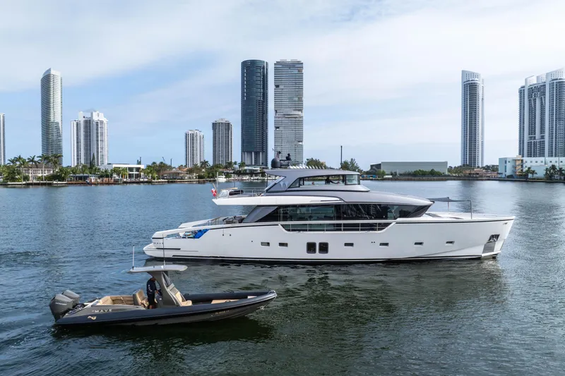 Mave Yacht Photos Pics 2020 Sanlorenzo SX88 yacht cruising near modern city skyline.