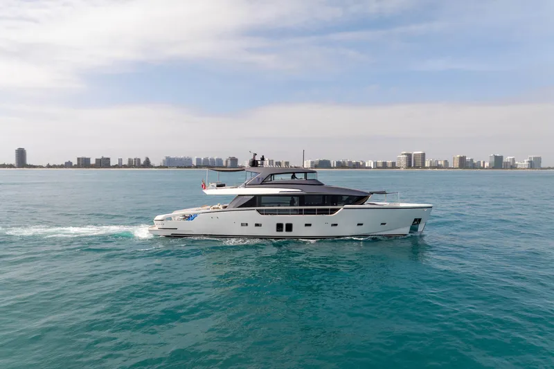 Mave Yacht Photos Pics 2020 Sanlorenzo SX88 yacht cruising on blue ocean with city skyline in background.