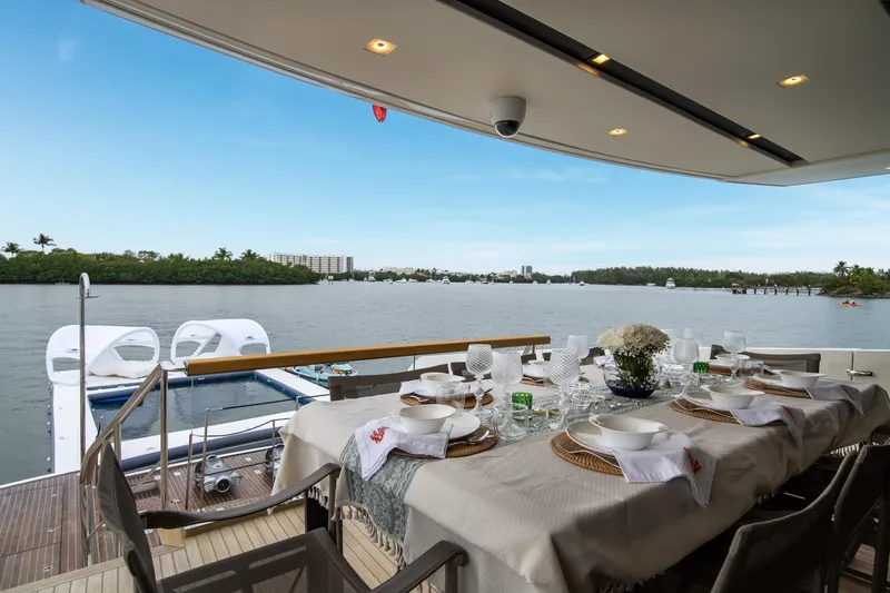 Mave Yacht Photos Pics Luxurious dining setup on 2020 Sanlorenzo SX88 yacht with scenic waterfront view.