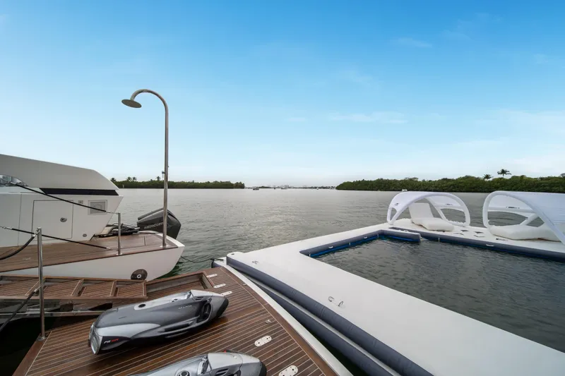 Mave Yacht Photos Pics Luxurious 2020 Sanlorenzo SX88 yacht with jet skis and pool on serene water.