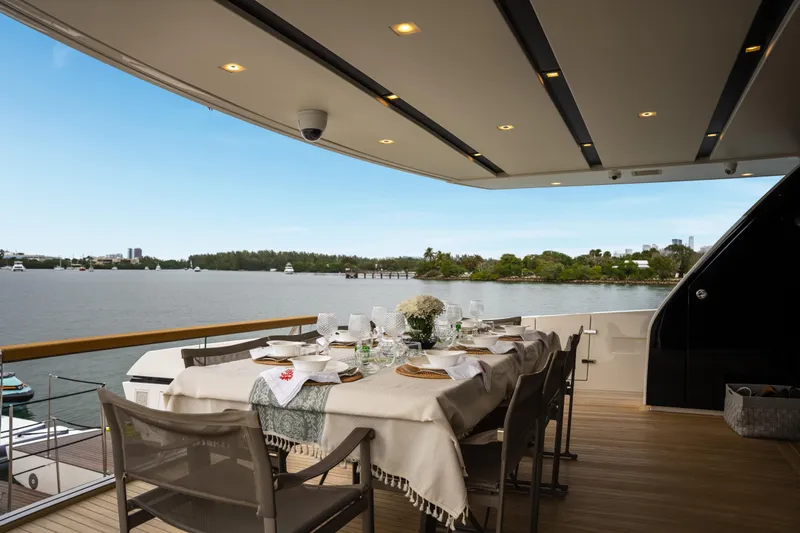 Mave Yacht Photos Pics Luxury dining setup on Sanlorenzo SX88 yacht, 2020, overlooking serene waterfront.
