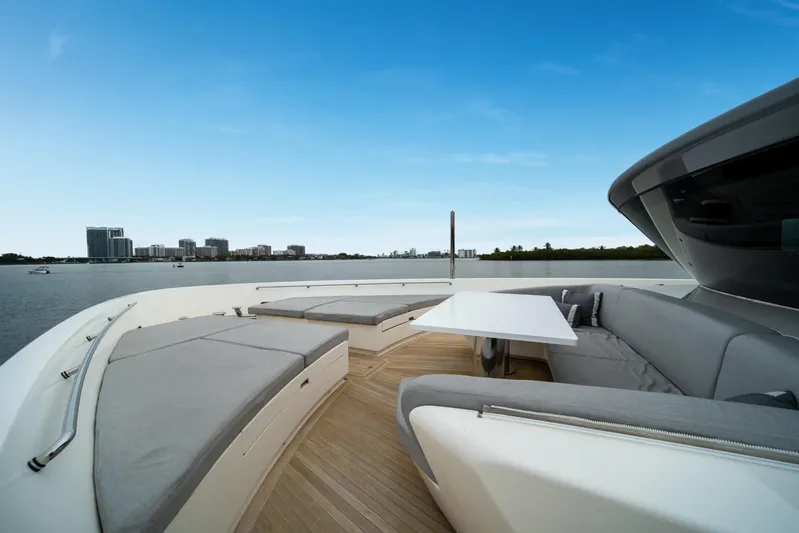 Mave Yacht Photos Pics Luxurious 2020 Sanlorenzo SX88 yacht deck with modern seating and scenic waterfront view.
