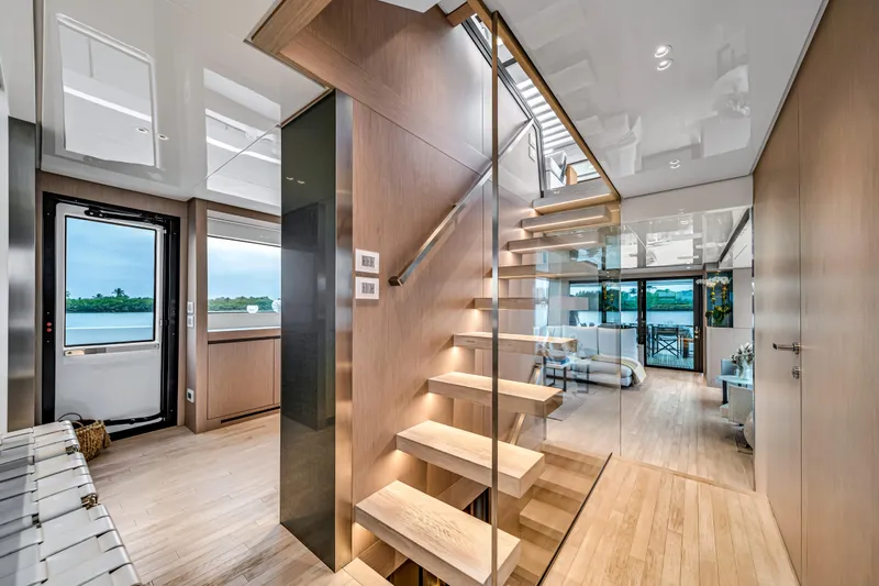 Mave Yacht Photos Pics Luxurious interior of 2020 Sanlorenzo SX88 yacht with modern staircase and elegant design.