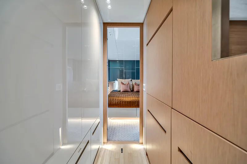 Mave Yacht Photos Pics Luxurious interior of 2020 Sanlorenzo SX88 yacht, featuring modern wood paneling and elegant bedroom.