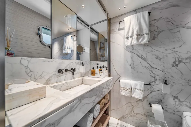 Mave Yacht Photos Pics Luxurious marble bathroom in 2020 Sanlorenzo SX88 yacht, featuring elegant fixtures and plush towels.